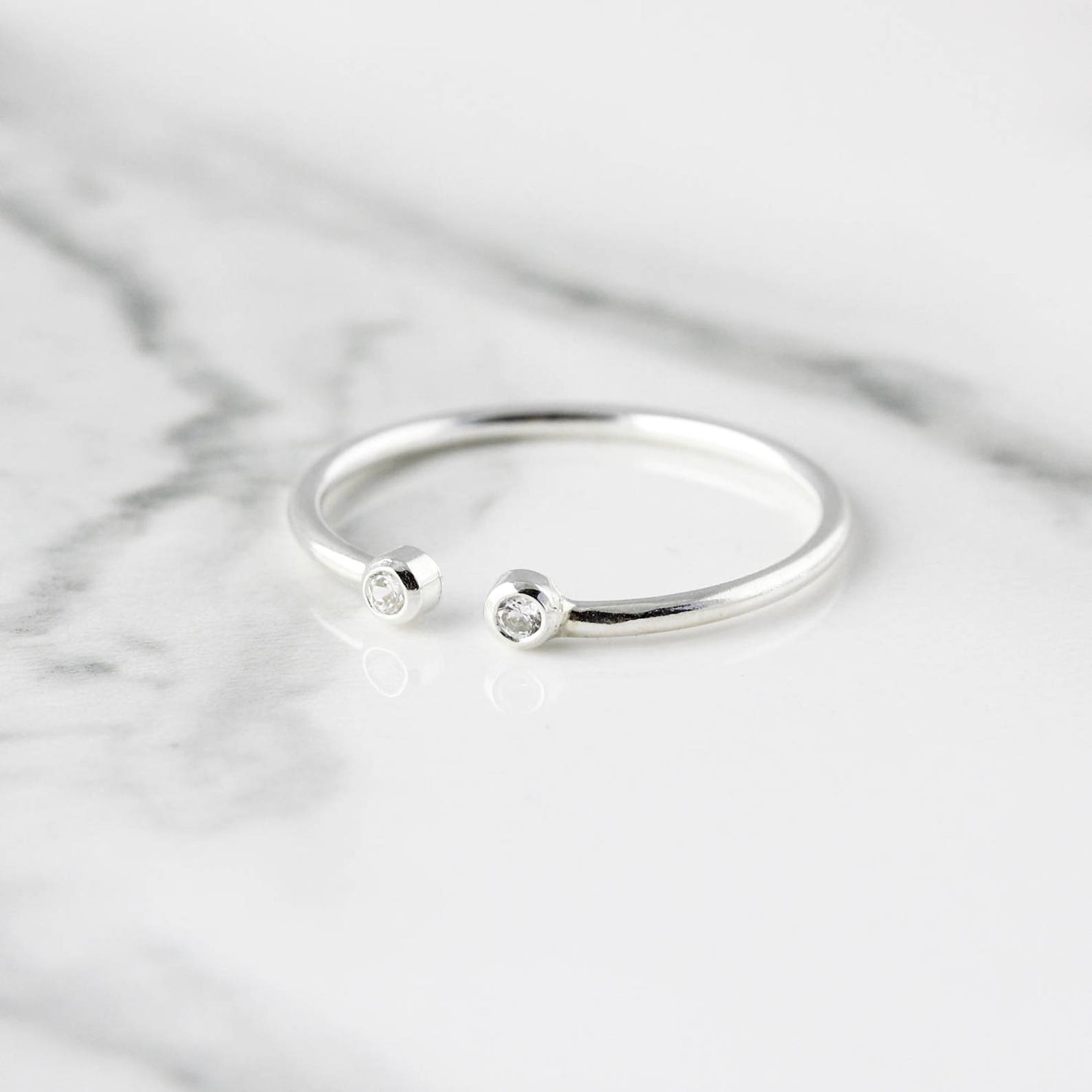 Open ring with two stones