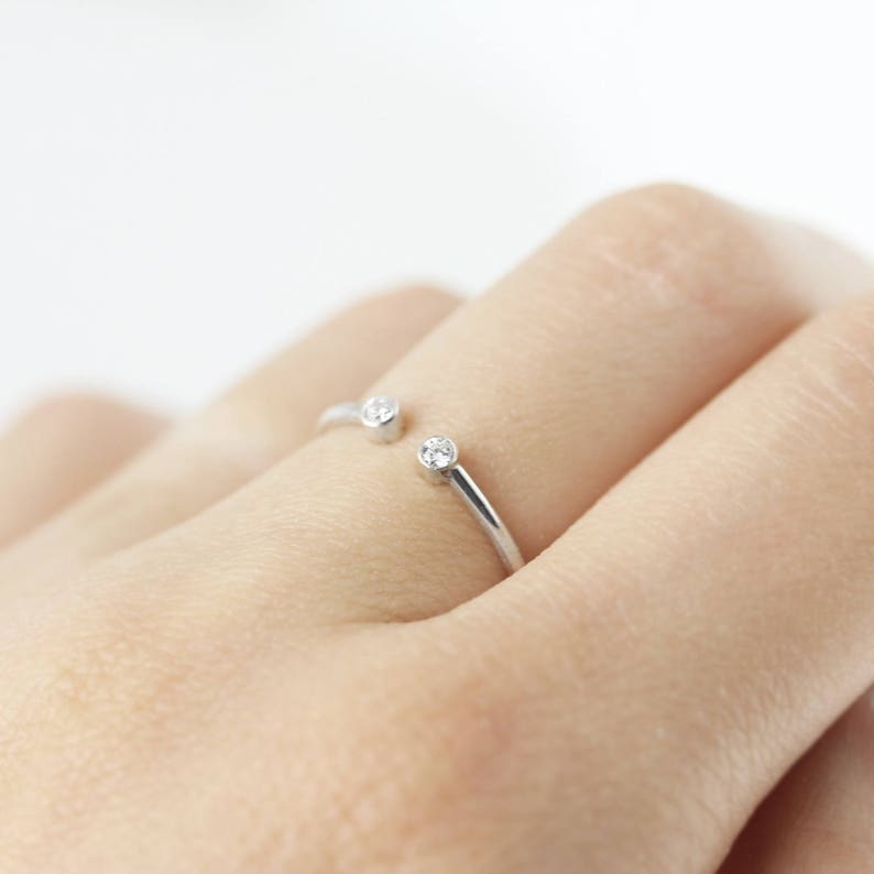 Open ring with two stones