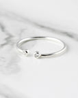 Open ring with two stones