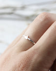 Ring with mini triangle