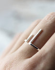 Open ring with two asymmetric bars