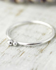 Ring with two silver balls