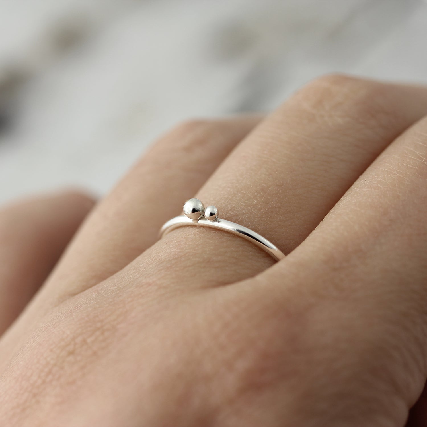 Ring with two silver balls